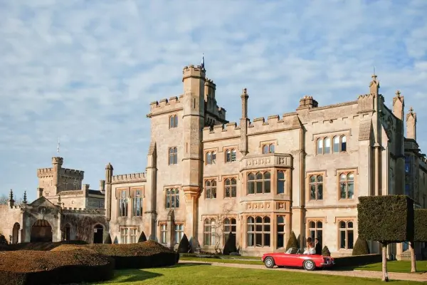 A stunning stone castle with turrets and manicured gardens, perfect for fairy-tale weddings or elegant outdoor ceremonies.