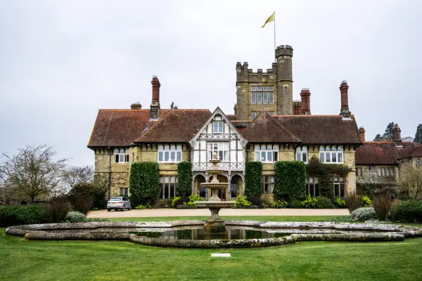 Stunning manor house with elegant architecture, manicured gardens, and a central fountain, perfect for sophisticated outdoor ceremonies.